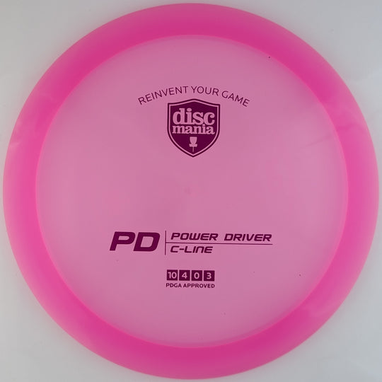 Transparent pink Discmania PD Power Driver disc, made from C-Line plastic blend, with purple foil stamp